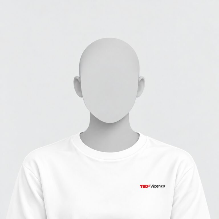 Immagine placeholder monocromatica di una figura umana senza volto, con testa rasata e maglietta bianca con logo TEDxVicenza sul petto, su sfondo grigio chiaro.